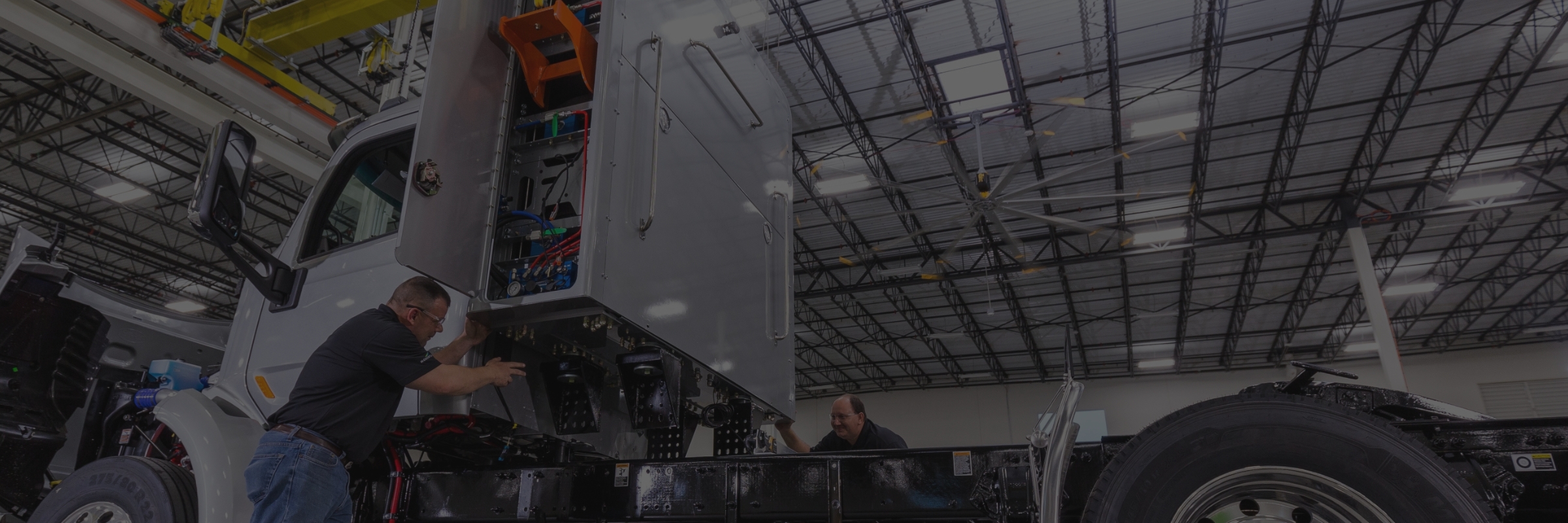 Technician installing CNG Fuel System on Truck